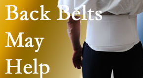 Manchester back pain sufferers wearing back support belts are supported and reminded to move carefully while healing.