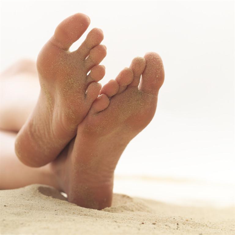 picture of feet on a sandy beach